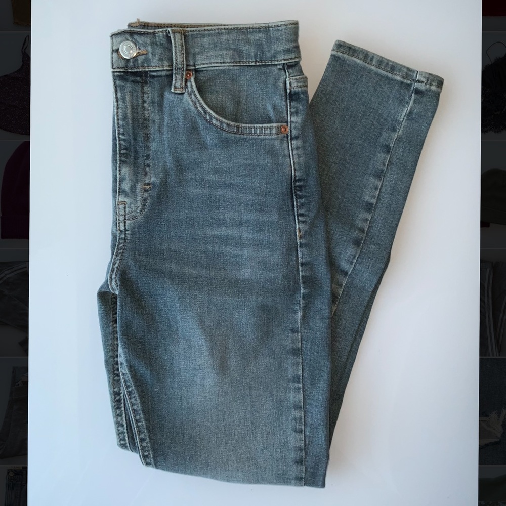 Topshop skinny jeans with a rip near the knee